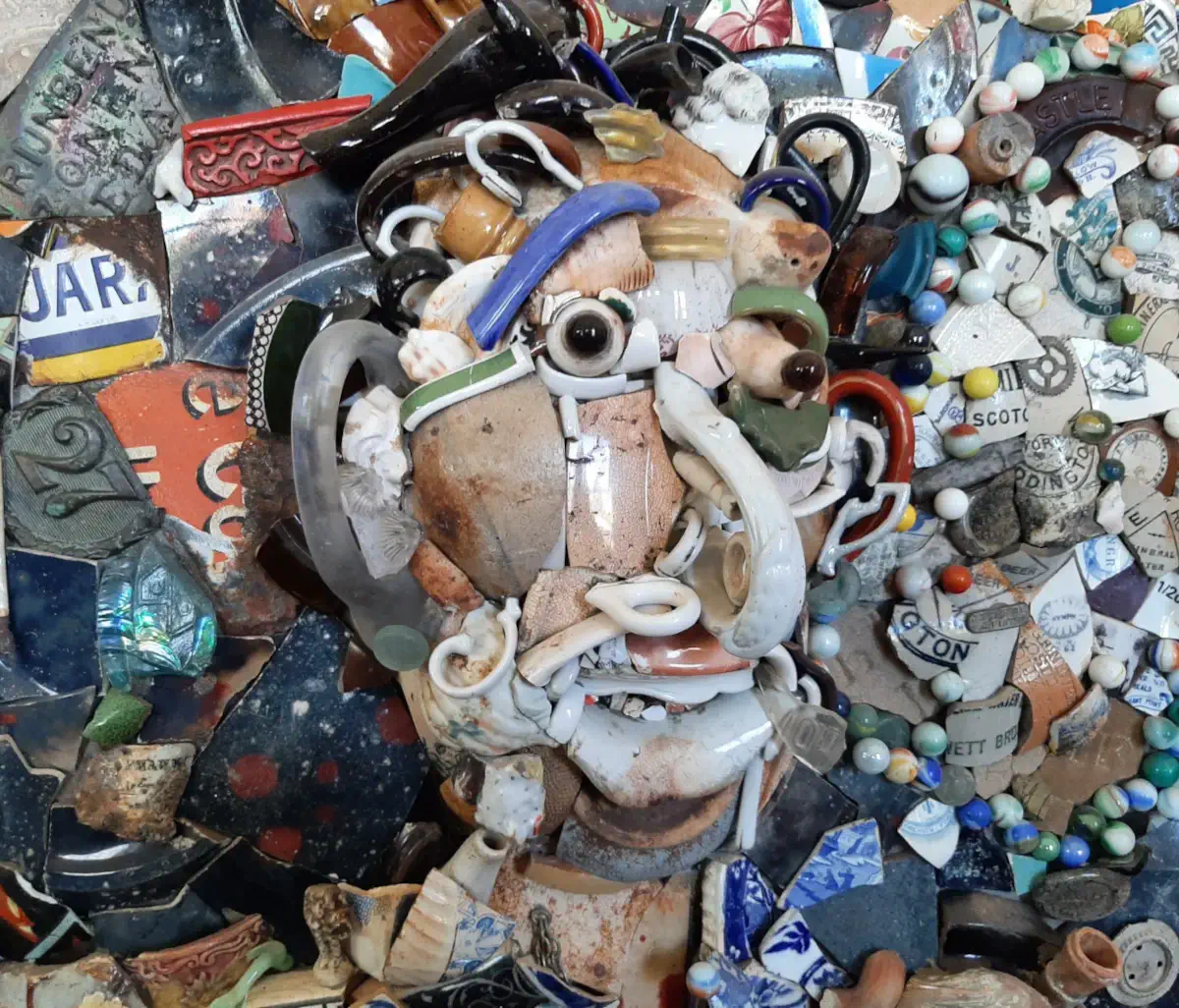 Broken porcelain portrait of a hobo in Point Rd Durban